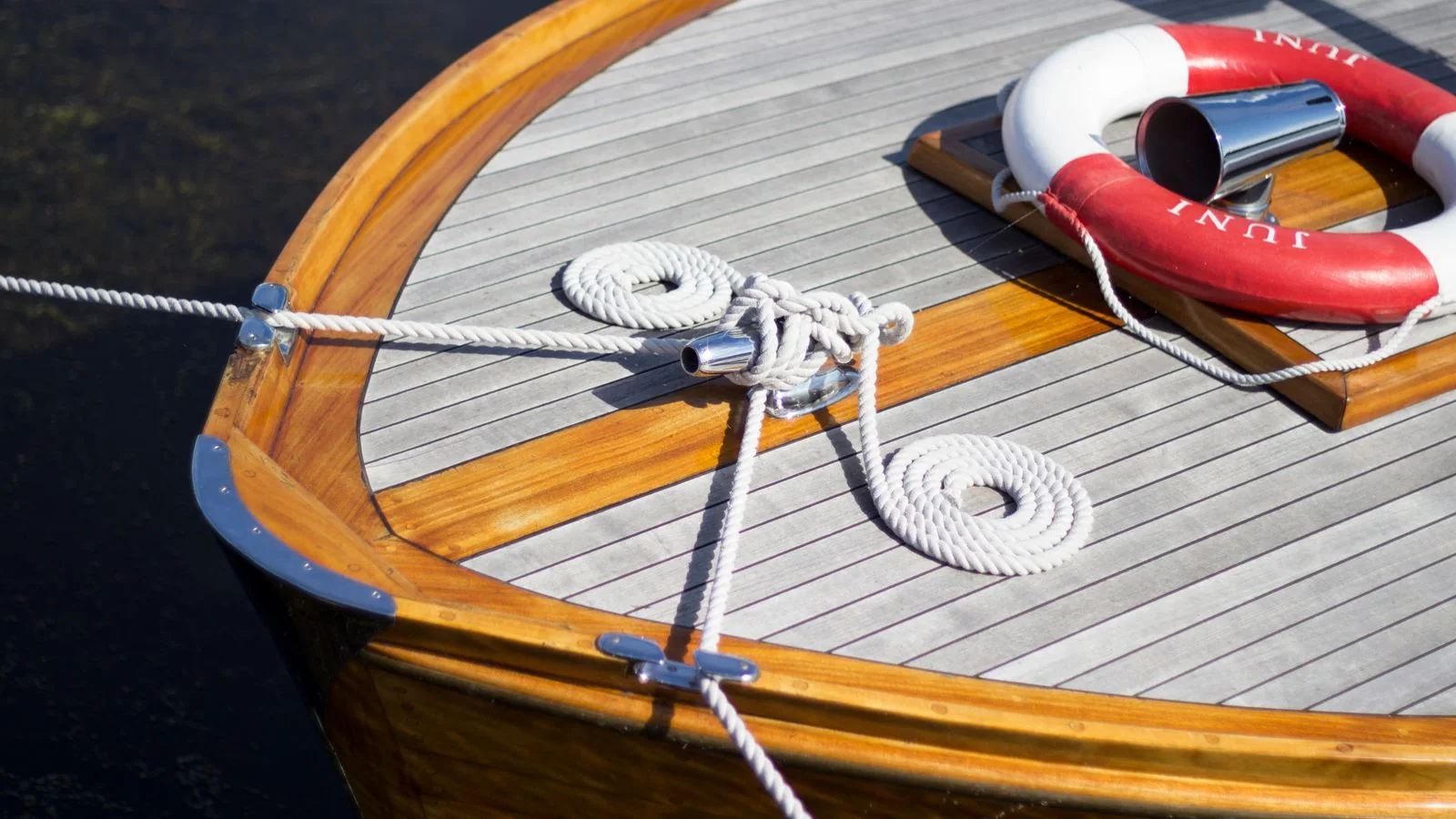 Wooden details on a sailboat deck.